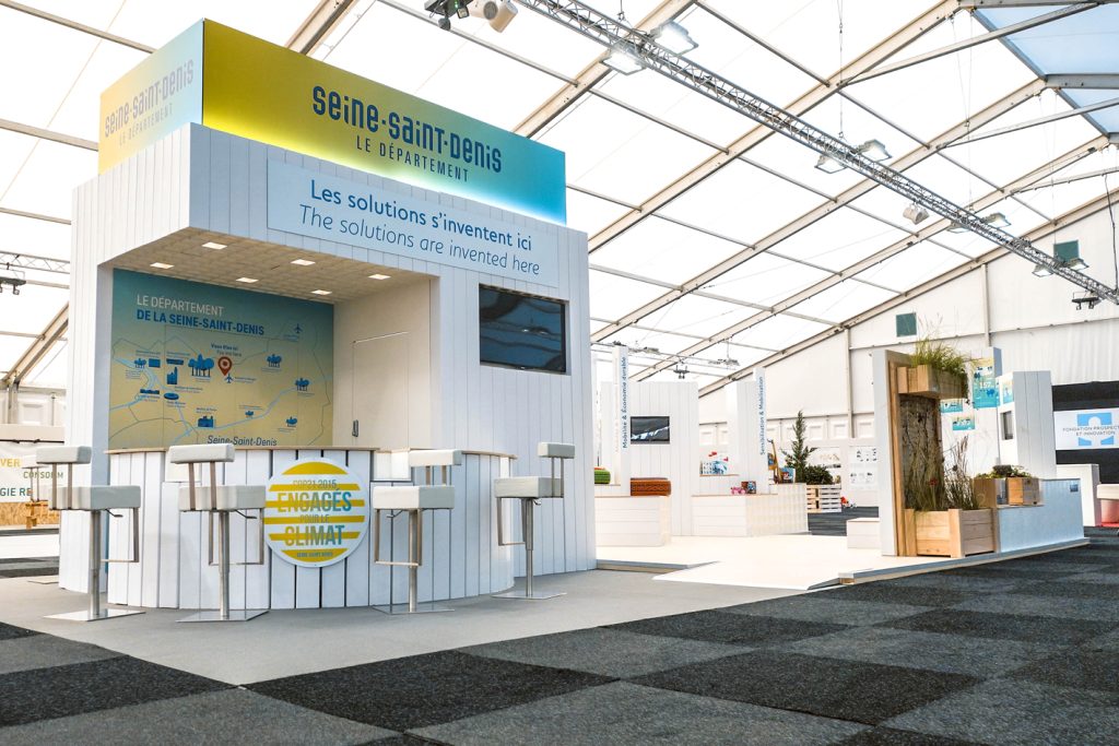 Stand du Conseil de la Seine Saint-Denis pour la Cop 21. Conception de la scénographie. Réalisation des plans de principe et suivi de fabrication. Surface : 60 m2 Collaboration avec l'agence Saisons Graphisme : Saisons Photos : Claude Lecante